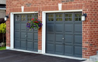 Black garage doors with hanging plants signs garage door needs repainting