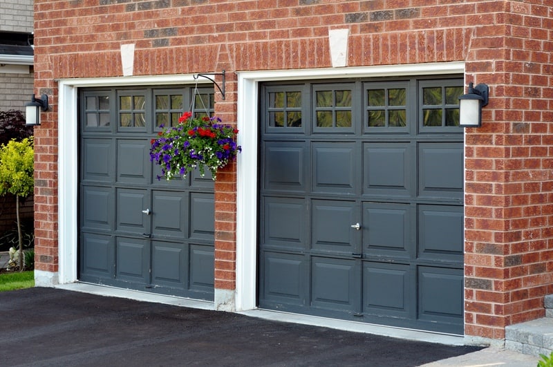 Garage Door Repainting Black garage doors with hanging plants signs garage door needs repainting