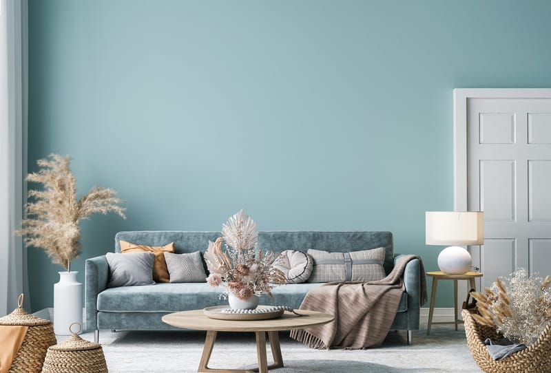 Interior House Painter Mint green interior wall with long velvet sofa
