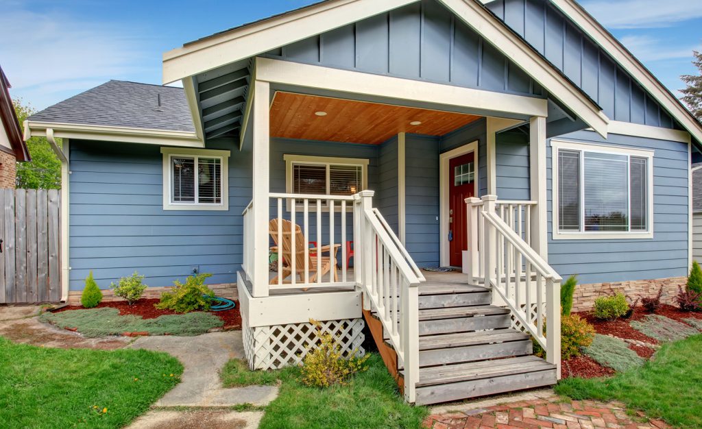 Blue bungalow house with white trims