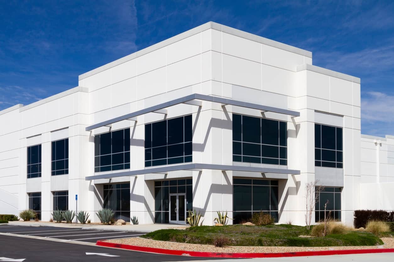 White commercial building with grey accent
