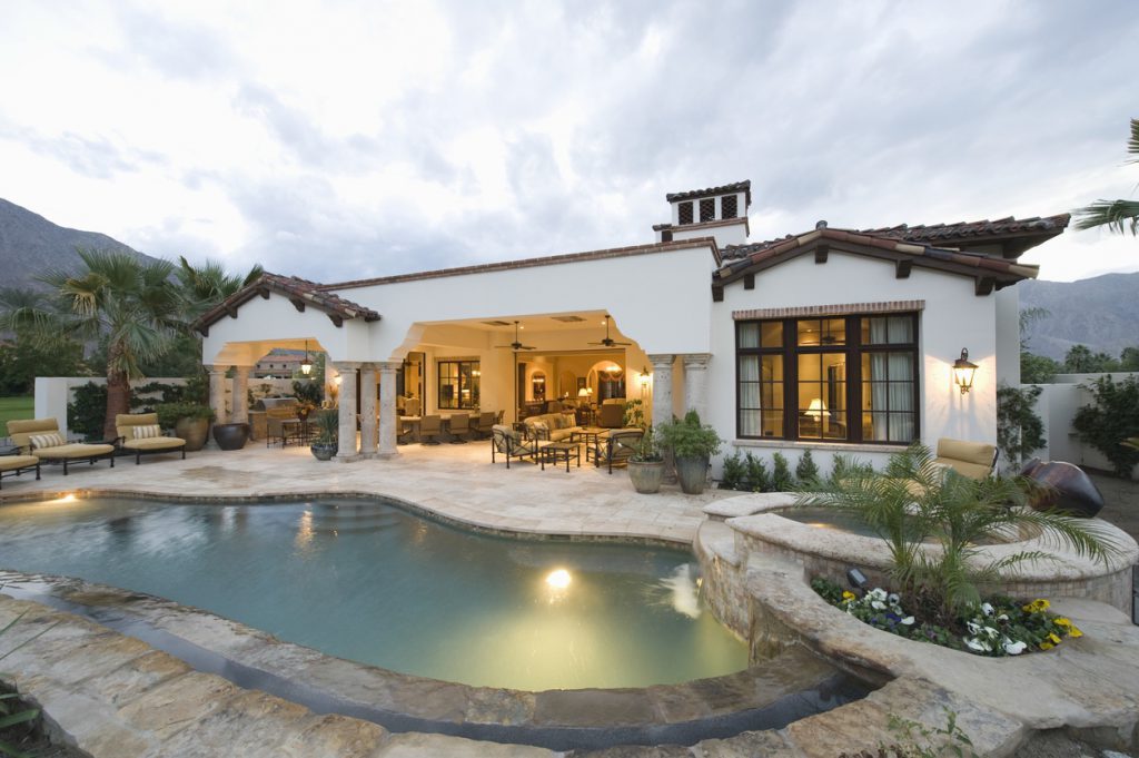 White residential exterior with pool