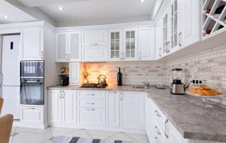 Modern kitchen with white cabinets by Local Cabinet Painters