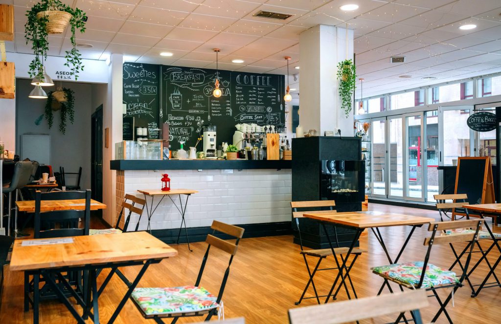 Empty cafe with wooden table and chairs