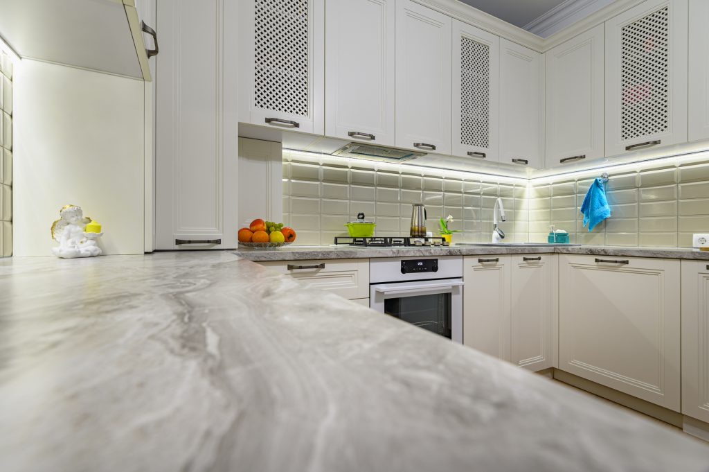 Small white cozy and comfy contemporary classic kitchen interior with wooden furniture,

Essential Cabinet Maintenance Tips 