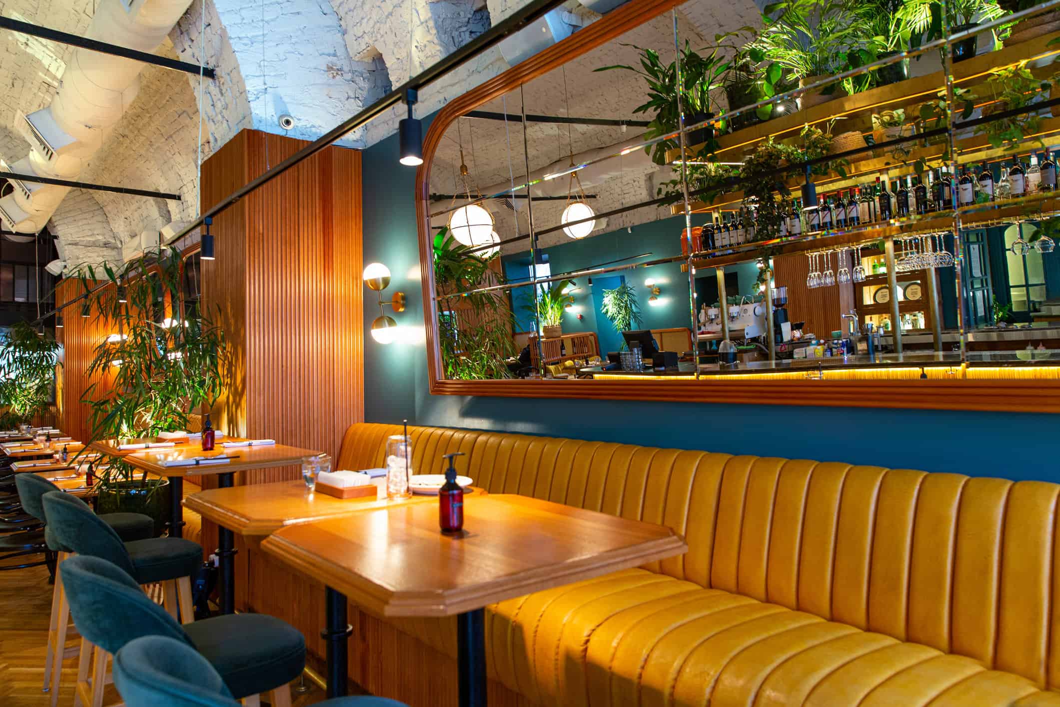 Restaurant professional painters Freshly paint Interior Commercial Painting of modern loft style restaurant with fresh flowers and mirror