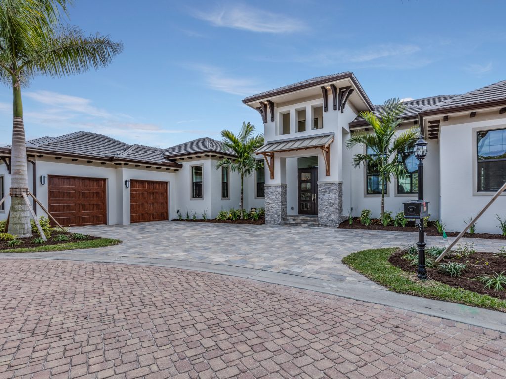 Stone circle driveway with side entry garage