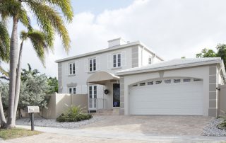 Stock image of a modern single-family home with garage. best white exterior home