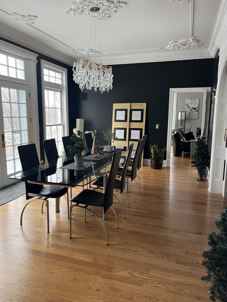 Modern dining room with wooden floors, creating paint and optical illusion of contrast