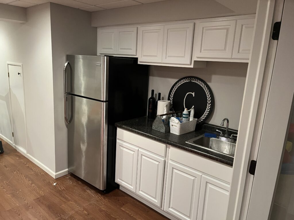 White kitchen cabinets with black counters