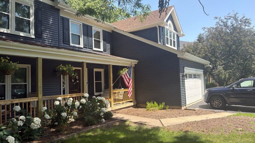 Exterior repaint, navy siding with white trim — A&A Painting